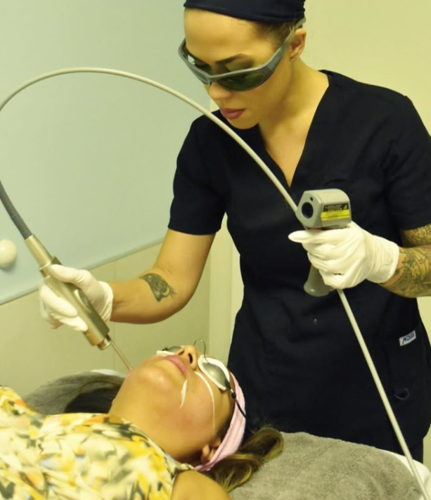 Clinician performing a Fotona 4D non-surgical facelift