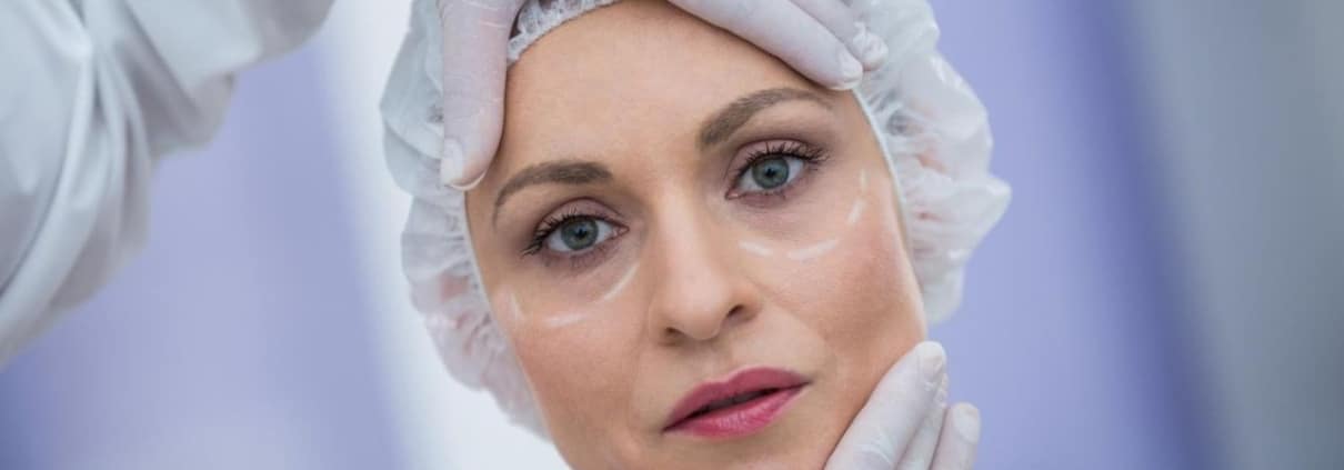 Close-up of a face as a professional performs a detailed skin assessment during treatment