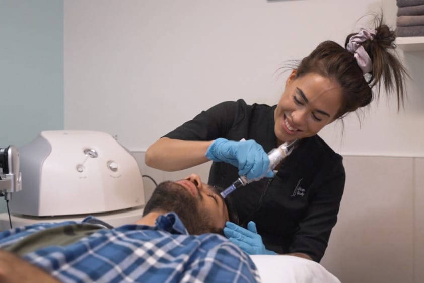 Laser treatment procedure being performed at Urban Body Laser clinic by a trained professional on a patient in a clinical setting