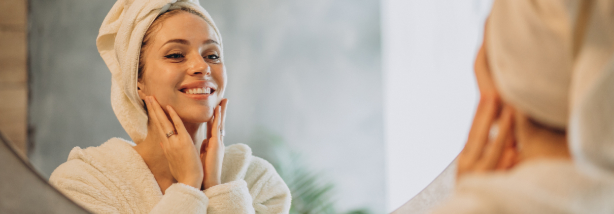 Woman at home applying cream mask